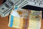 Народный банк: Курс доллара будет колебаться на уровне 310-330 тенге